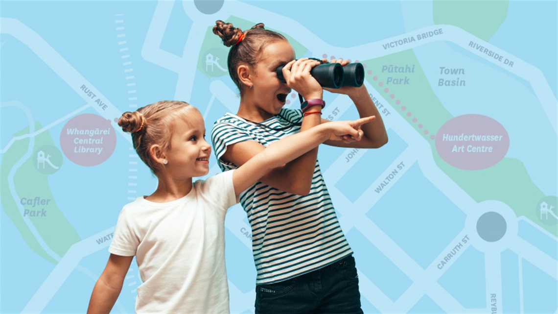 Two girls, one looking through binocualrs and the orher pointing with a map of Central Whangārei in the background. 