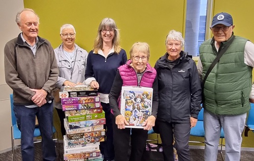 Group of people who attended the Jigsaw Puzzle Exhange at Whangārei Central Library on 20 August 2023. 