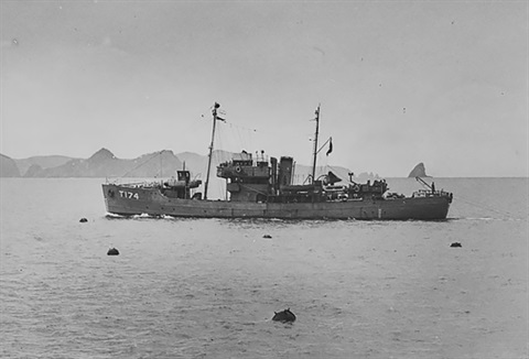 Photo of HMNZS Killegray, T174, Isles class clearing sea mines in the Bay of Islands. Taken by Tudor Collins 1943. 