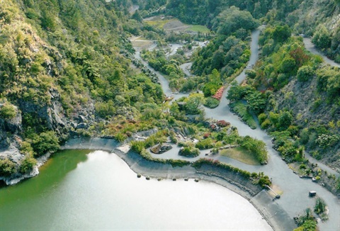 Picture of an overview of the Whangarei Quarry Gardens in 2011, showing the lake and pathways. 