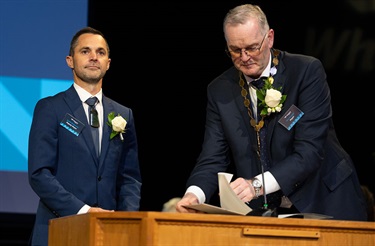 Deputy Mayor Scott McKenzie and Mayor Ken Couper on stage at the swearing-in ceremony. 