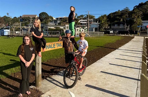 A group of local kids at the Whale Tail Park playground entrance. 