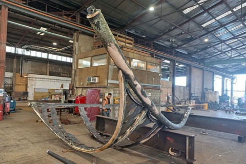 The 'Sail' sculpture from the southern entrance to Whangārei being restored by Culham Engineering inside a warehouse. 