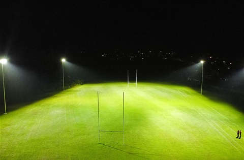 Otangarei sports field lit up at night. 