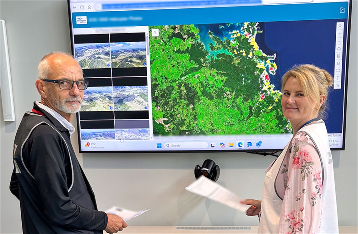 Whangarei District Council Civil Defence Local Controller Victorica Harwood and Local Recovery Manager Tony Phipps review map of the impacted area ahead of the transition decision. 