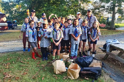 Te Kamo Scout Group poses for a group photo with some of the rubbish they've collected. 