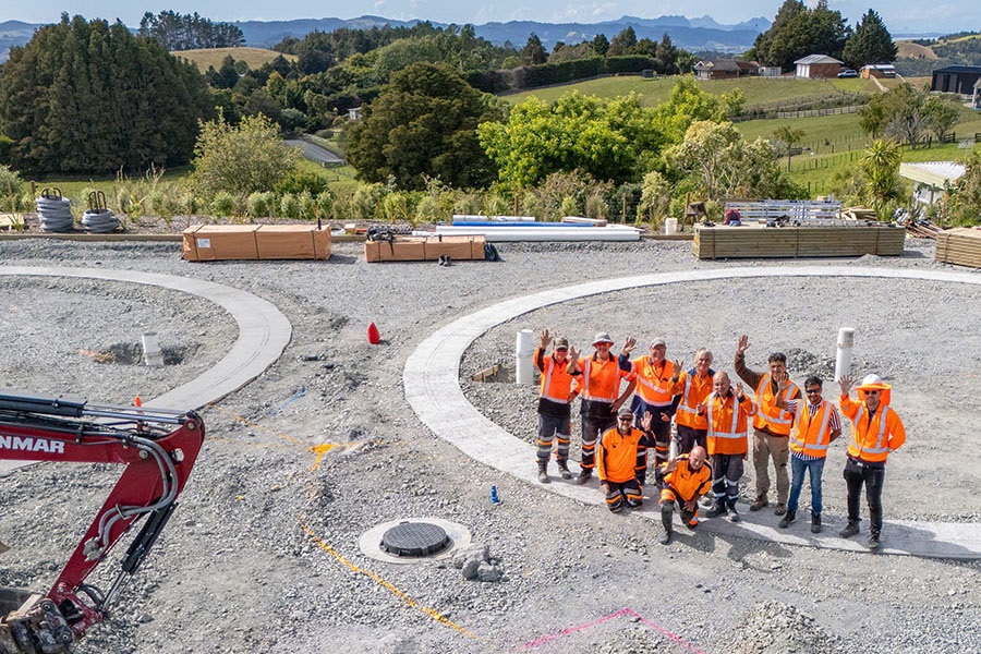 Council staff and workers from Timber Tanks and Ventia pose for a photo during construction of the timber water reservoirs.