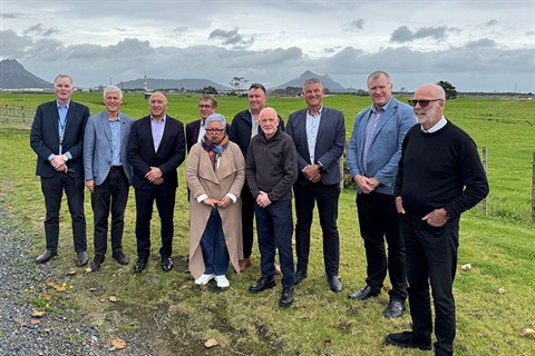 The mayors and chairs from the Upper North Island Strategic Alliance (UNISA) pose for a photo with Whangārei Heads in the background. 