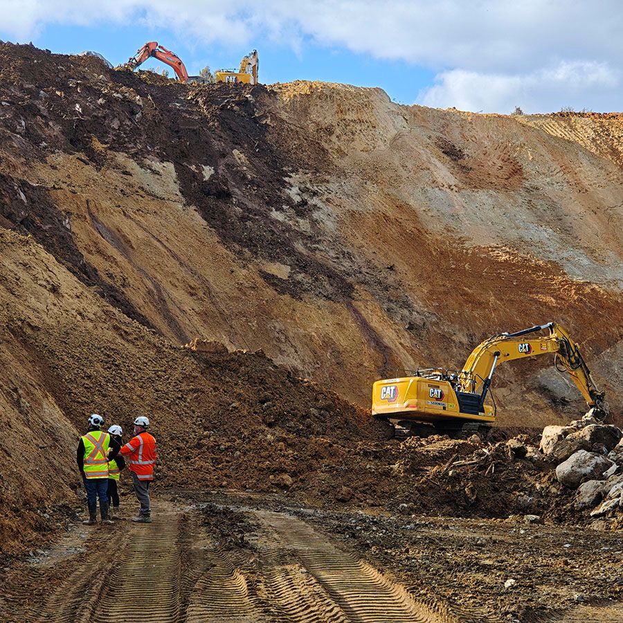 Photo of the slip site showing progress along the slip face where the seam of unstable, moving slip material was discovered.