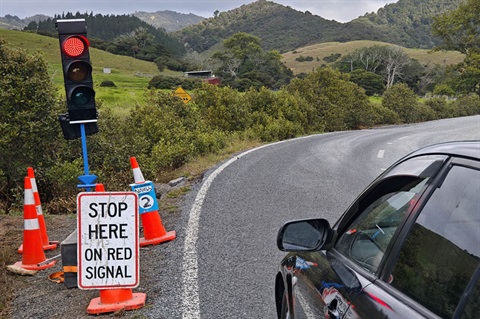 A car stopped at the red traffic light on Kaiikanui Road, Whangarei. 