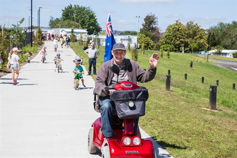 Elder man on mobility scooter on Kamo Shared Path