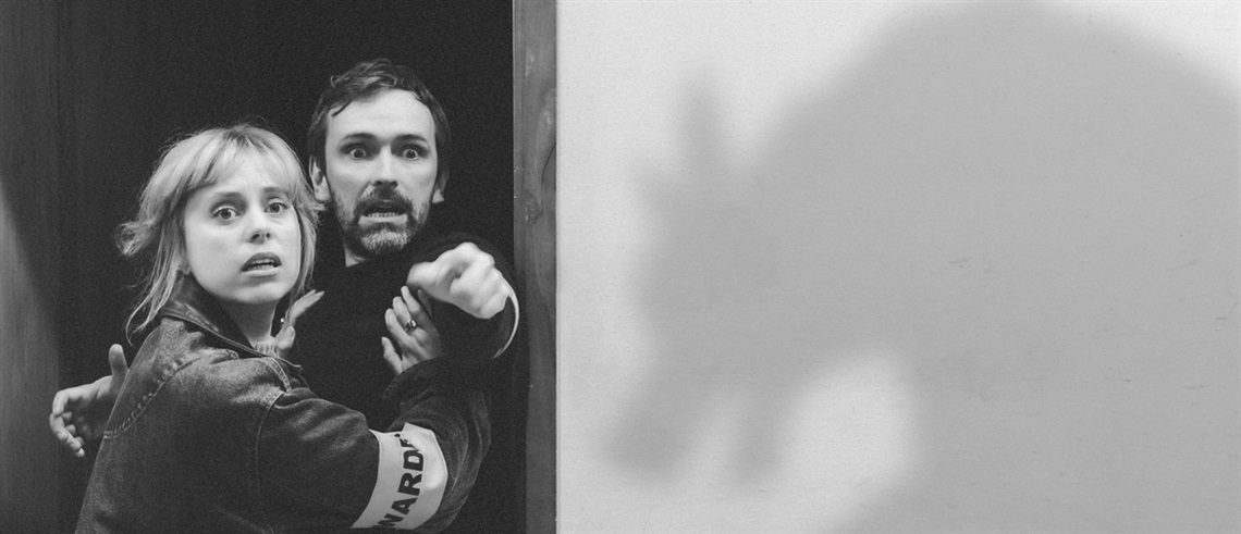 Image of two actors on the left and a werewolf on the right. 