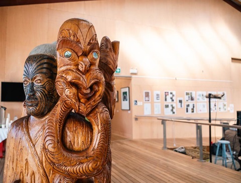Image of Maori carvings on display. 