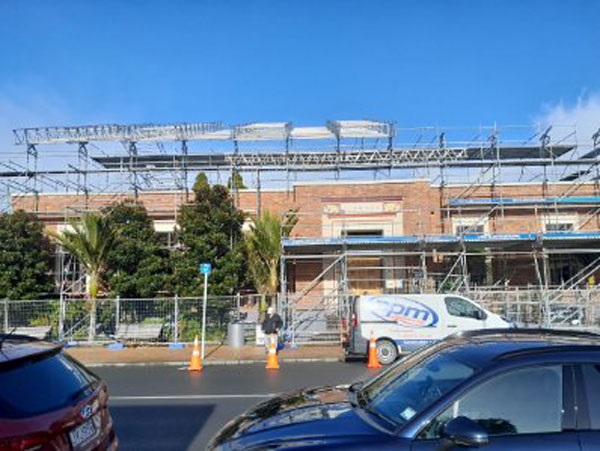 Scaffolding structure being set up on the Old Library roof.