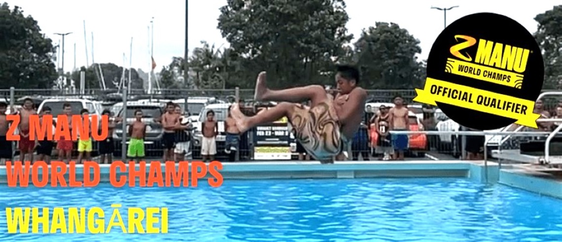 A person is mid-air performing a cannonball-style dive into a swimming pool, wearing patterned shorts. In the background, several spectators stand near a metal fence, some in swimwear. The scene takes place outdoors with trees and parked vehicles visible behind the fence. Bold text on the left reads “Z MANU WORLD CHAMPS WHANGĀREI” in red and yellow. On the top right, there is a black circular logo with “Z MANU WORLD CHAMPS” in yellow and “OFFICIAL QUALIFIER” on a yellow ribbon.