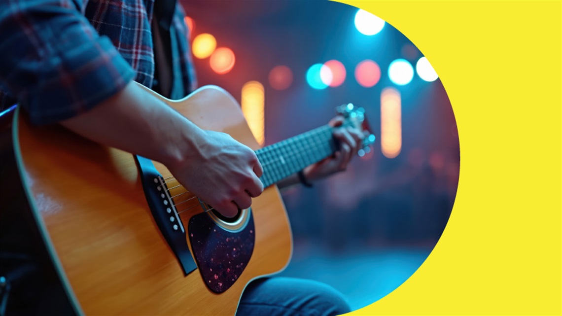 Close up of someone playing a guitar.
