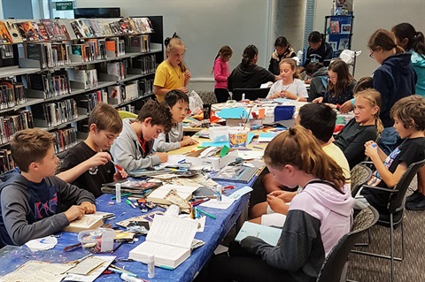 Photo of children at a school holiday programme at the Whangārei Central Library. 