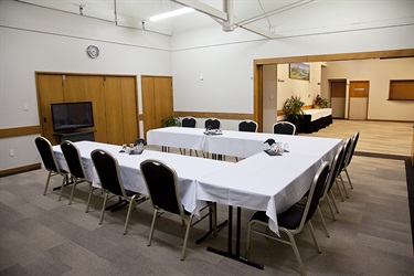 Bounty Room boardroom layout with chairs and tables setup, second angle.