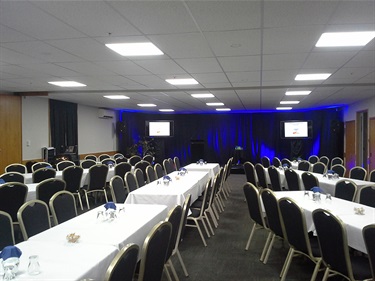 Cafler Suite in an alternative banquet layout with tables and chairs setup.