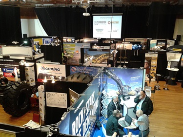 Exhibition Hall expo layout with many promotional stalls displayed.