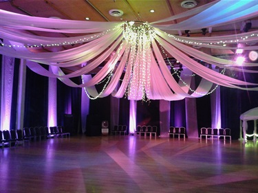 Exhibition Hall with ribbon decorations hanging over the dance floor.