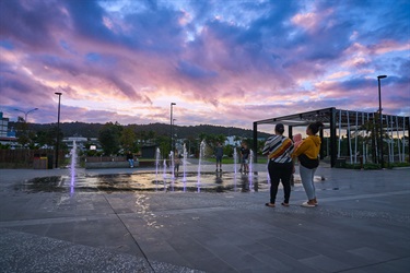 Families-standing-by-the-water-feature.jpg