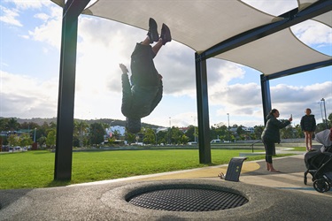 Kid jumping on trampoline