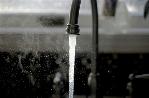 A tap with water running out of it. 