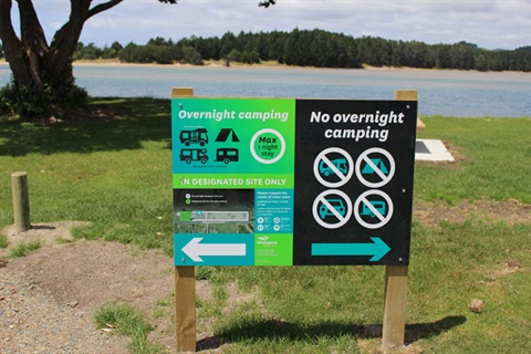 Photo of Whangarei District Council freedom camping signs at a beach. 