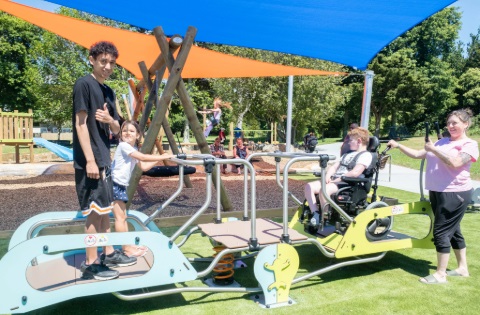 A photo of children playing on the see-saw at the new Raumanga Playground.